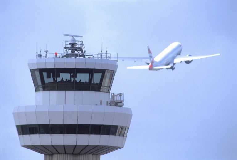 Gatwick Airport, Control tower with aircraft in flight in background, DP, 19 August 2004, (CGA857)