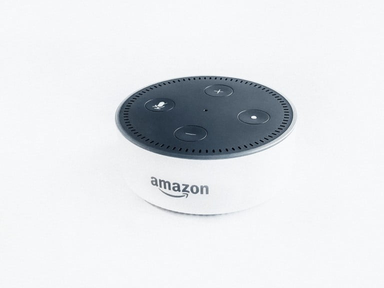An Amazon echo dot in white
