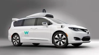 Image of Waymo self driving cars white