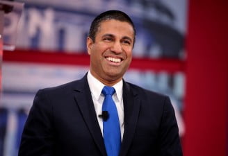 A portrait of Ajit Pai smiling, congress fails to save net neutrality
