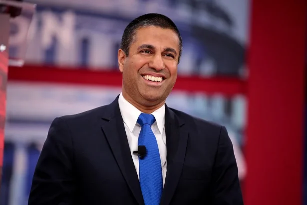 A portrait of Ajit Pai smiling, congress fails to save net neutrality