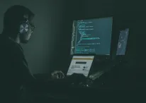 A person coding on his computer