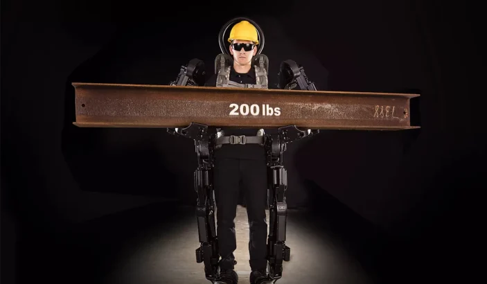 human wearing sarcos exoskeleton suit