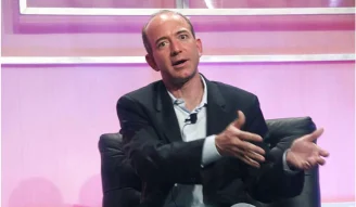 Jeff Bezos talking to a media personal during an interview