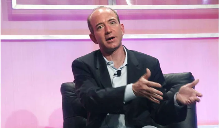 Jeff Bezos talking to a media personal during an interview