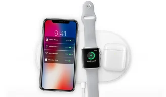 A photo of Apple devices getting charged wirelessly with AirPower