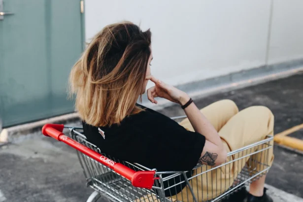 A photo of a girl sitting in a shopping cart