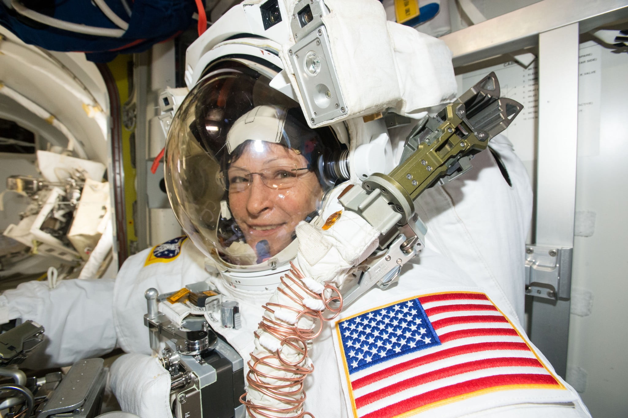 Expedition 50 Flight Engineer Peggy Whitson is suited up in the U.S. Quest airlock getting ready for her record-breaking eighth spacewalk.