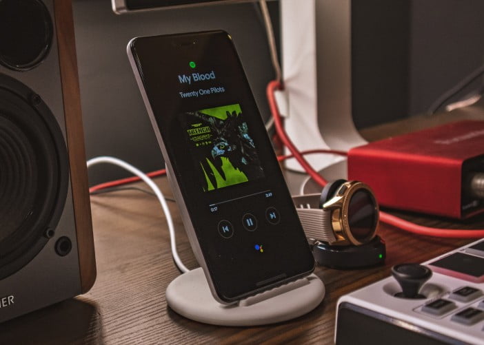 A Photo Of Google Pixel 3 Xl Showing Spotify Running On A Bedside Table