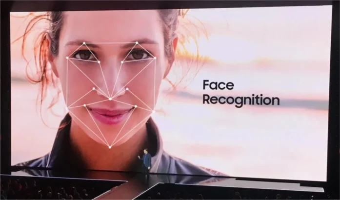 A picture of presentation screen showing a face with face recognition feature at Samsung event