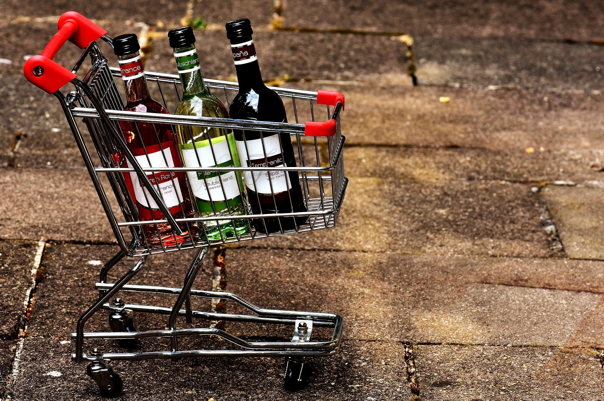 A Photo Of Shopping Cart With Three Different Drinks In It