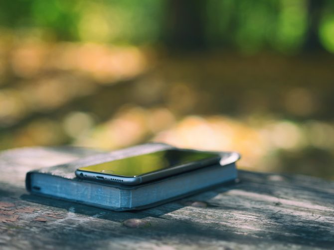 A Photo Of Iphone 6S On A Book