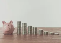 A photo of Piggy bank and coins