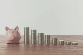A photo of Piggy bank and coins