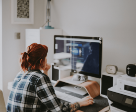 a girl looking at her computer