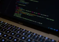 Code displayed on a MacBook