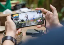 A photo of a person playing PUBG on mobile phone