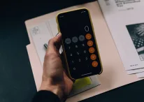 A person using calculator