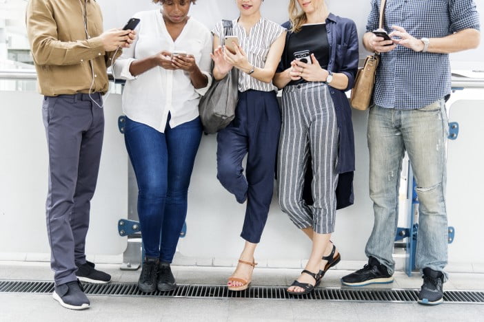 Group Of Diverse People Using Smartphones