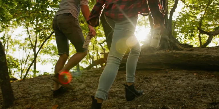 A kid with his mother going on hiking