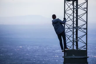 A person on a network tower