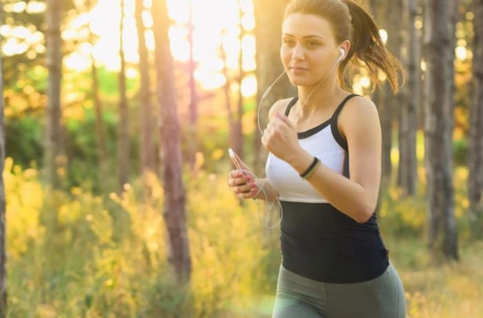 A Girl Listening To Music While Jogging