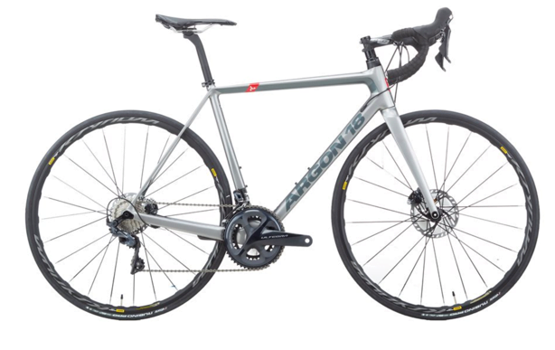 A bicycle leaning against a wall