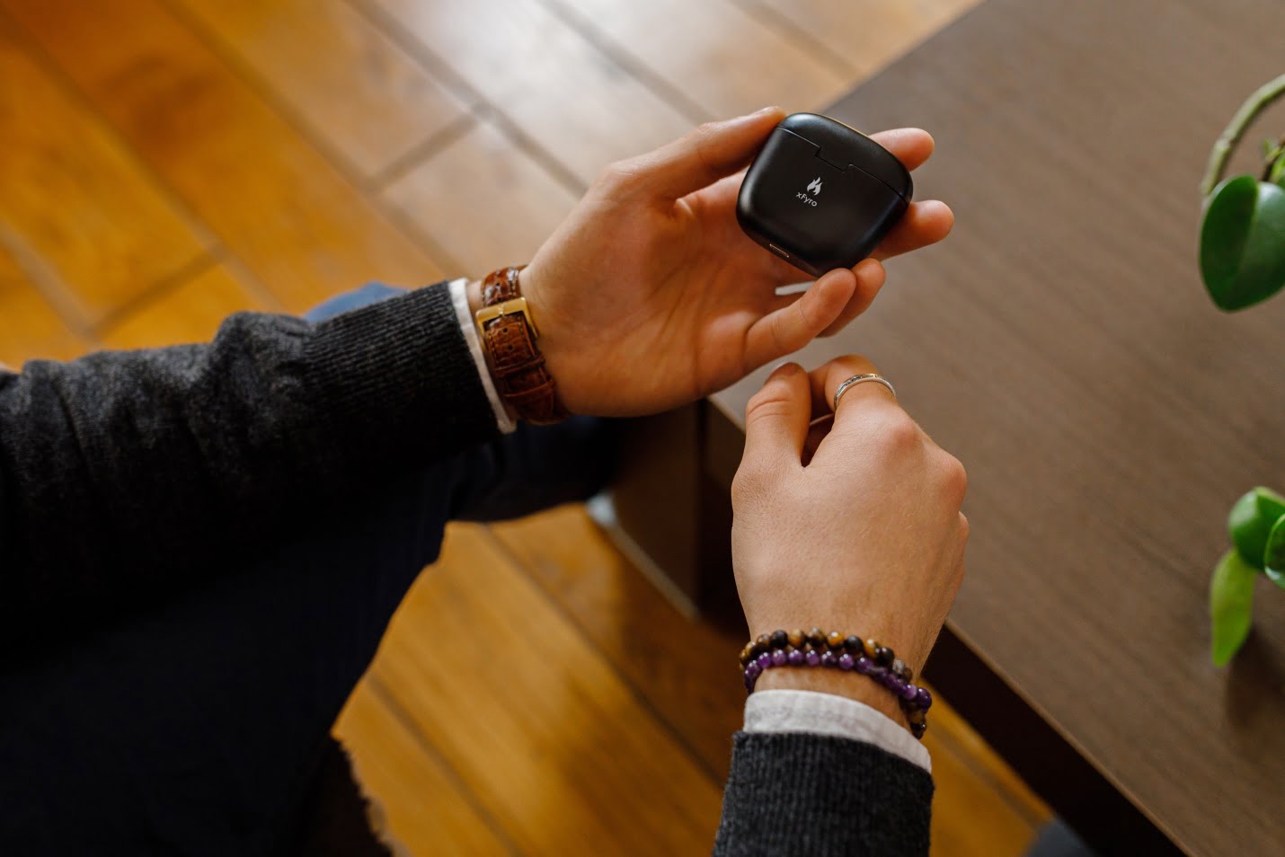 A Person Holding Earphones' Box