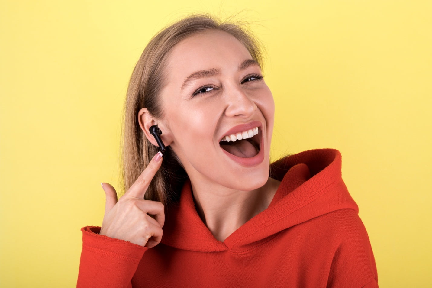 A Girl Wearing Wireless Headphones