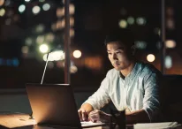 A picture containing computer, table, sitting, computer Description automatically generated