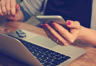 Woman holding an iPhone