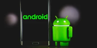 An Android dummy standing near an Android phone