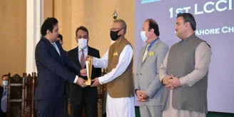 Jazib Zaman receiving best software company award for TechAbout