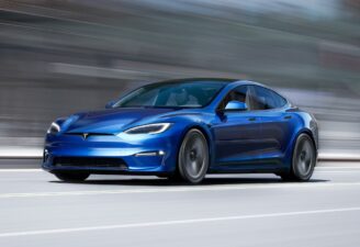 A Tesla Model S in Blue color, hitting the road