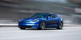 A Tesla Model S in Blue color, hitting the road